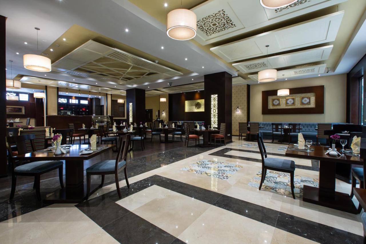 Triumph Plaza Hotel Kaherah Luaran gambar