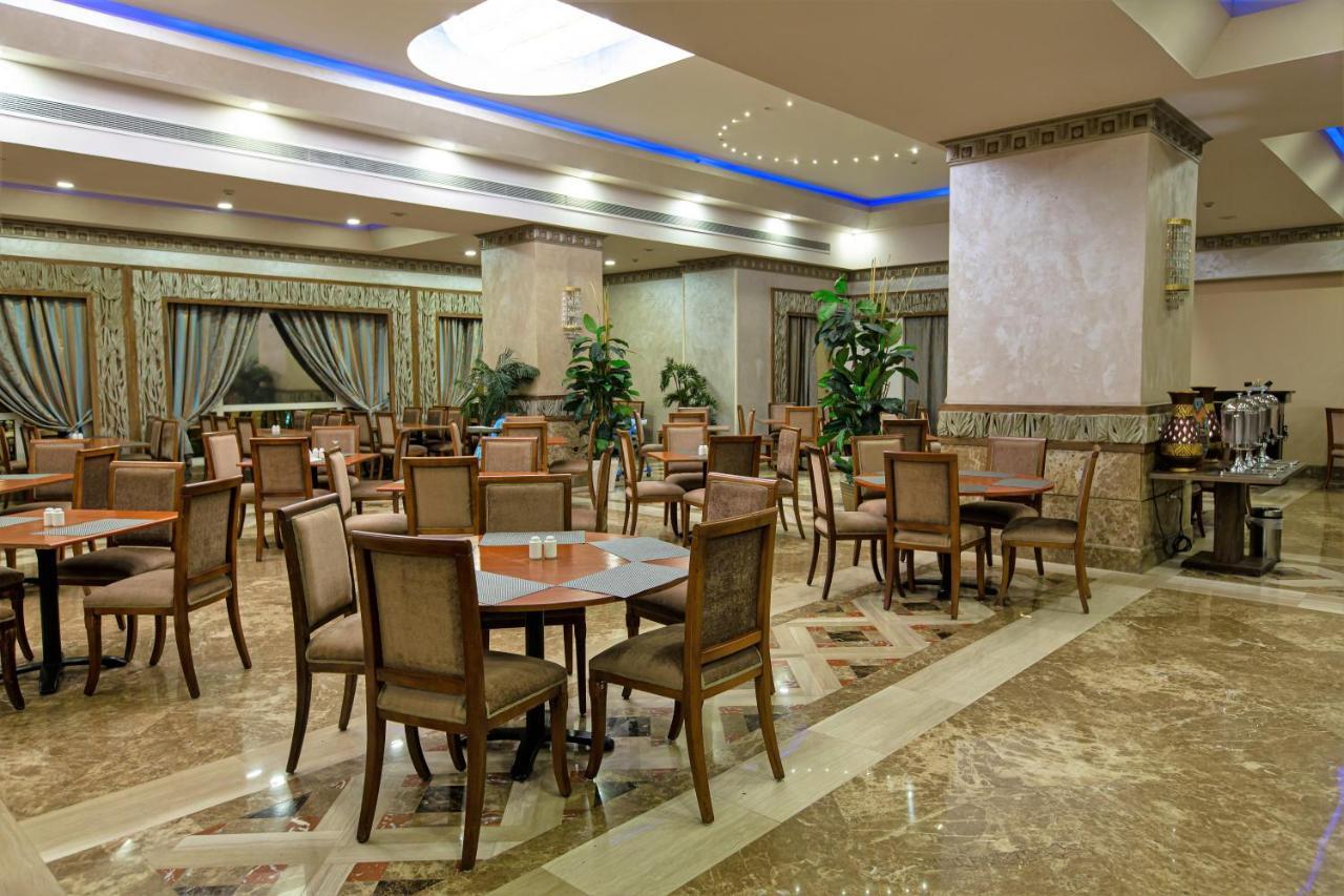Triumph Plaza Hotel Kaherah Luaran gambar