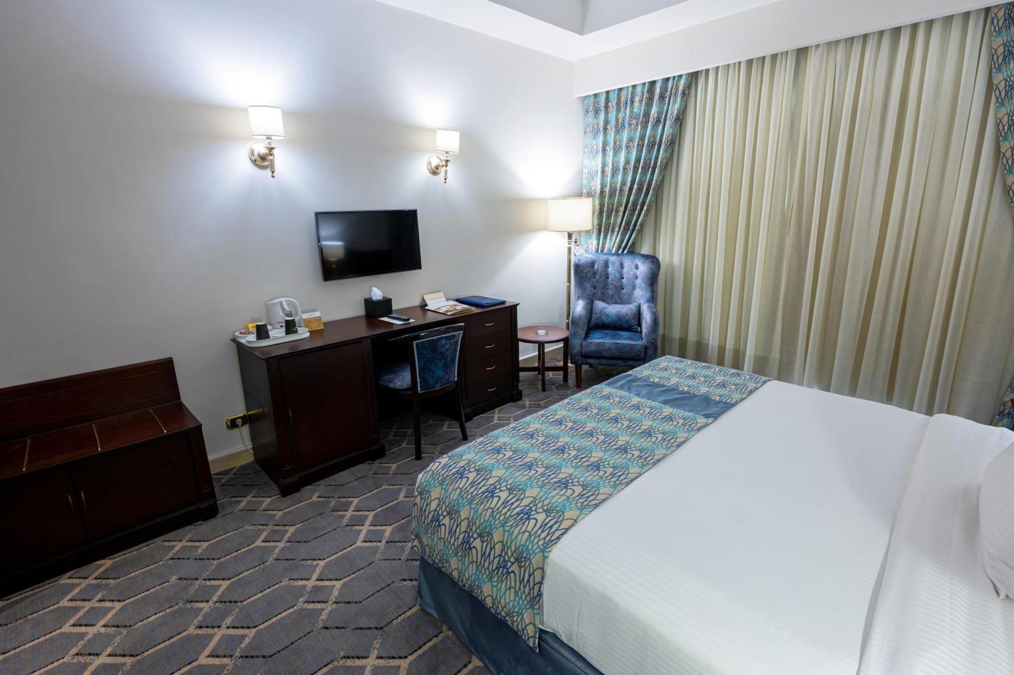 Triumph Plaza Hotel Kaherah Bilik gambar