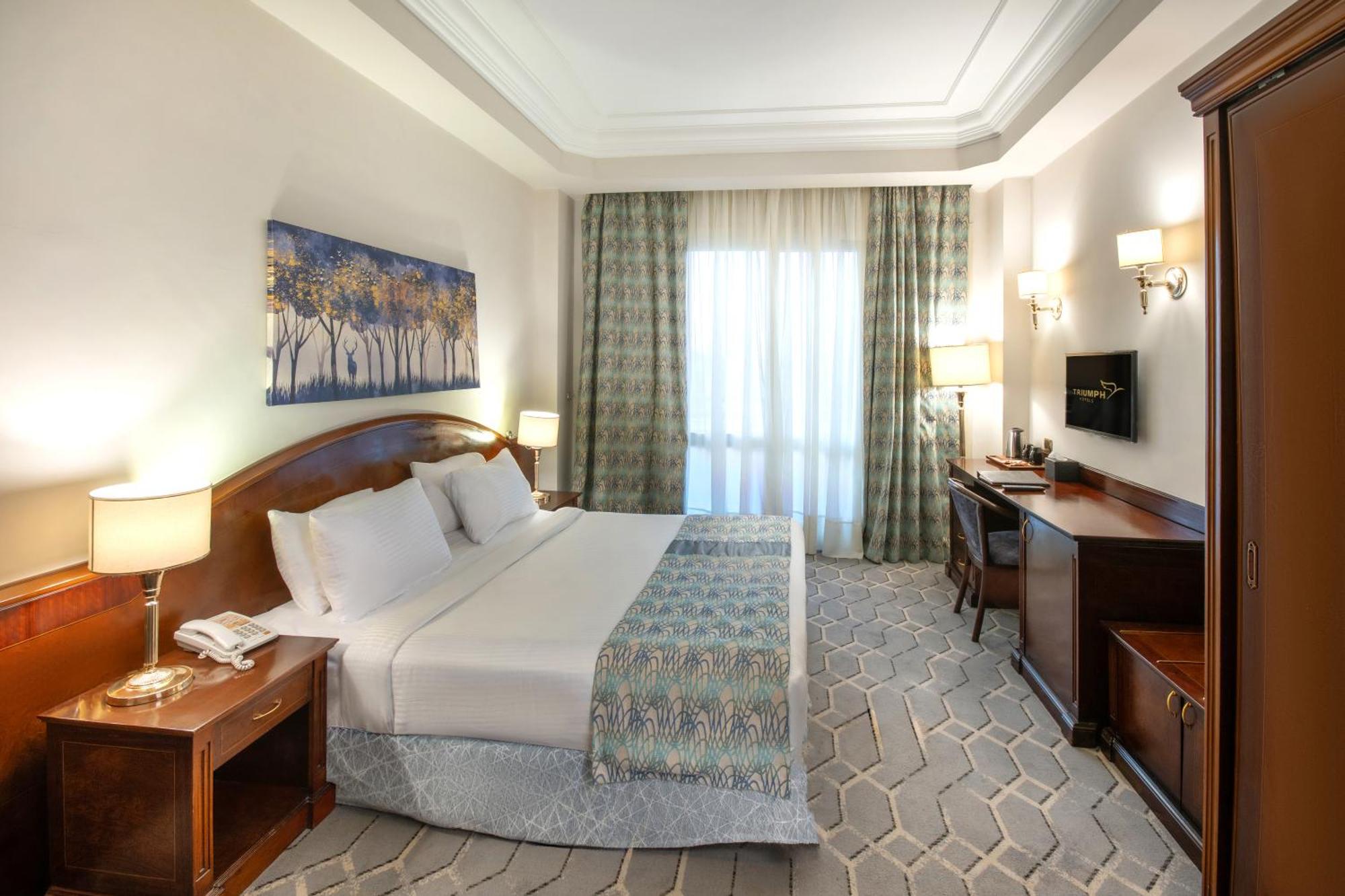 Triumph Plaza Hotel Kaherah Bilik gambar