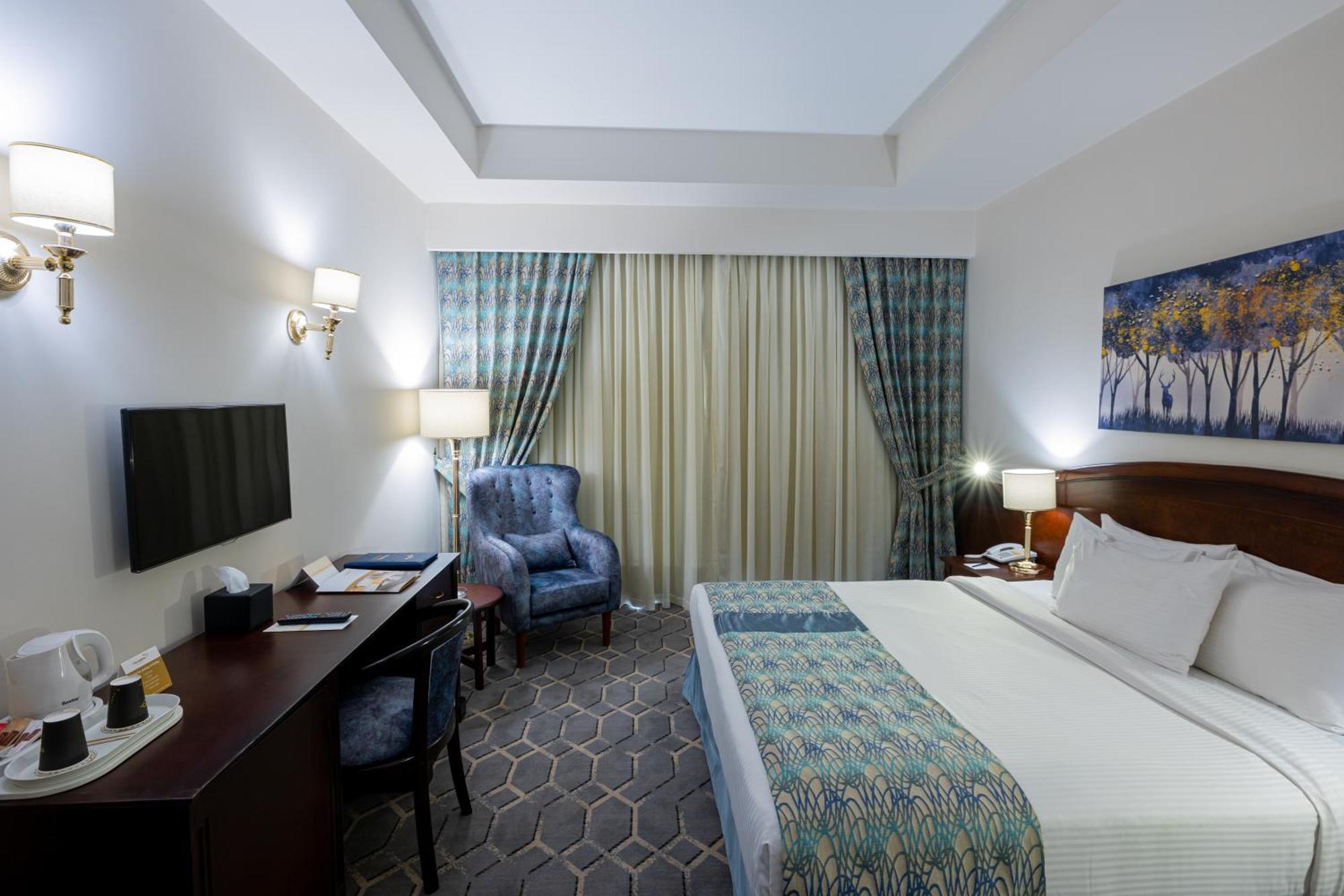 Triumph Plaza Hotel Kaherah Bilik gambar