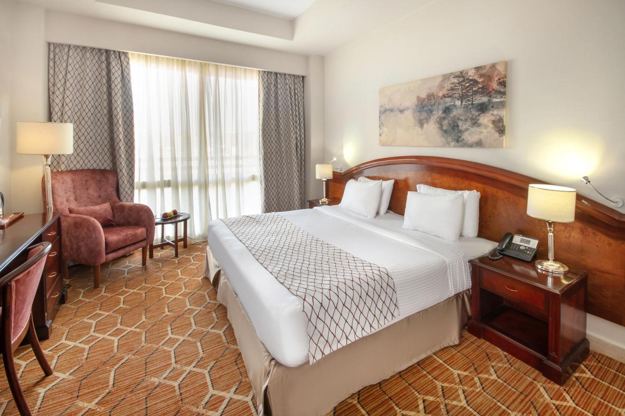 Triumph Plaza Hotel Kaherah Bilik gambar