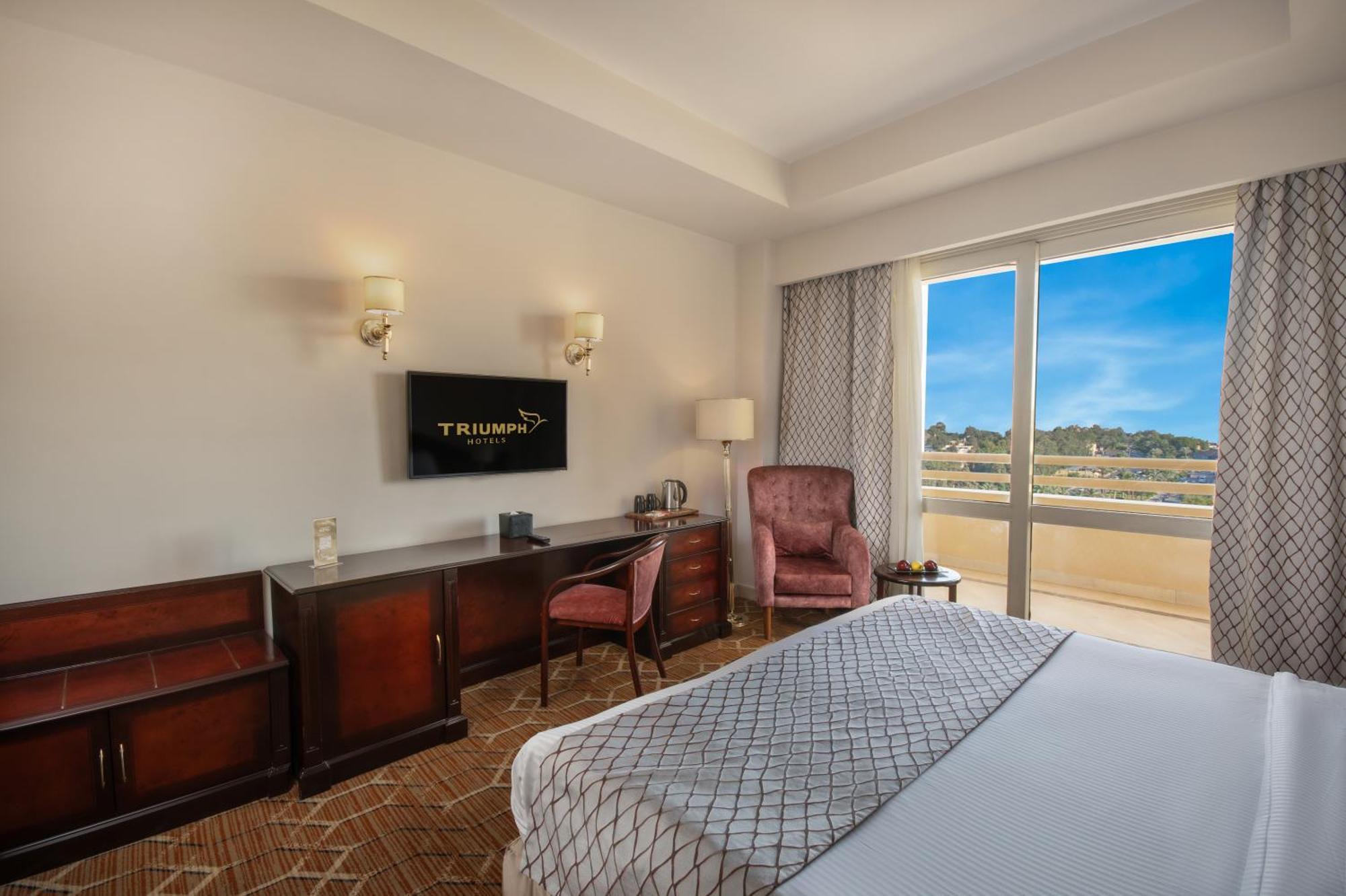 Triumph Plaza Hotel Kaherah Bilik gambar