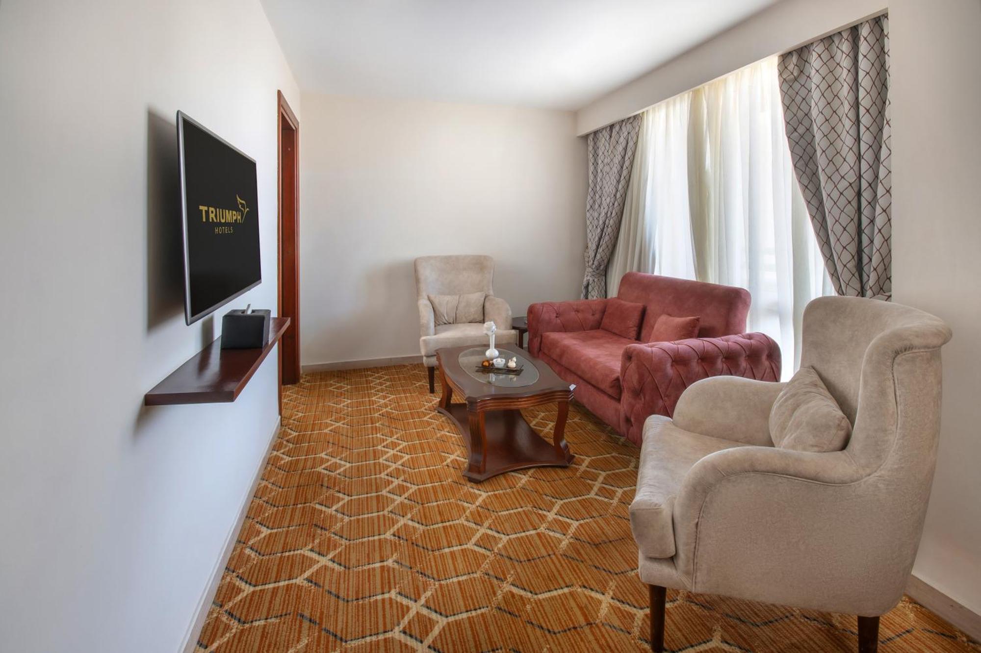 Triumph Plaza Hotel Kaherah Bilik gambar