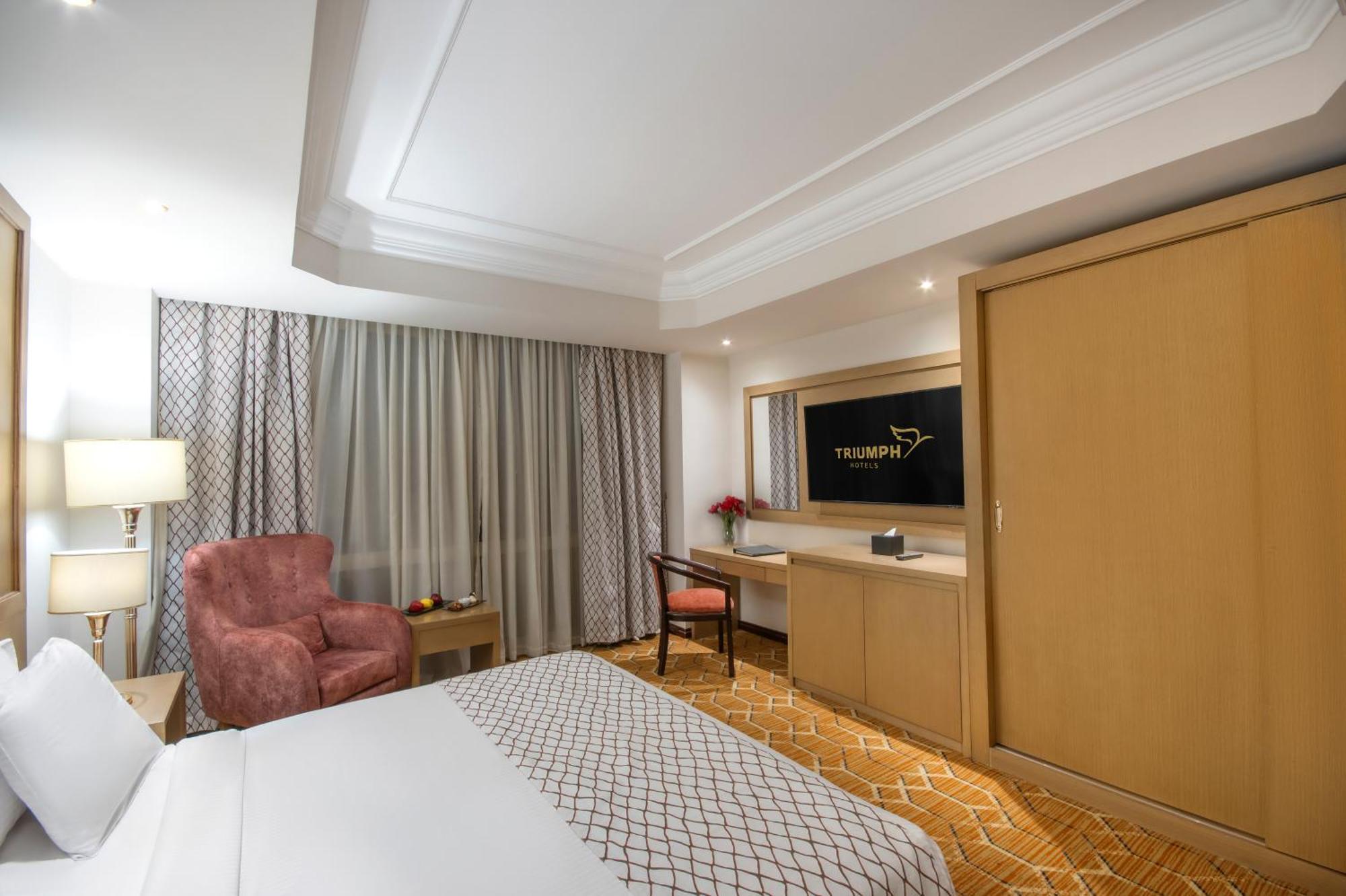 Triumph Plaza Hotel Kaherah Bilik gambar